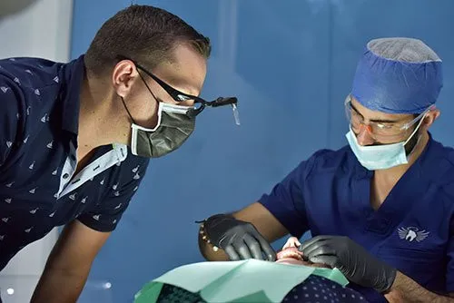 Dentist and and his assistant working on a patient at Goodness Dental in Costa Rica